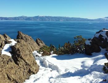 Eagle Rock with snow overlooking tahoe