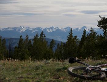 trail with mountain bike laying down overlooking view