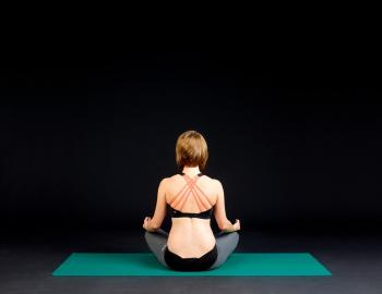 back of woman in a yoga pose