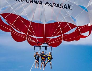 people parasailing in the air