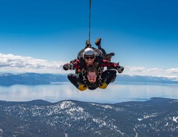 two men flying in the sky 