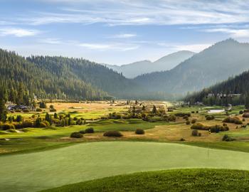 golf course with mountains surrounding