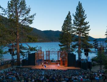 actors stage with waters of tahoe in background