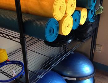 yoga mats on a shelf