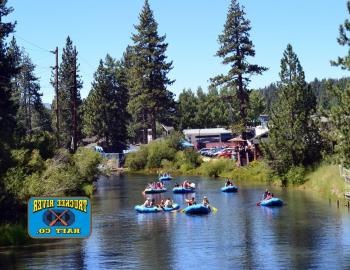 people on calm river in rafts