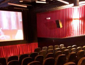 seats and movie screen in theater 