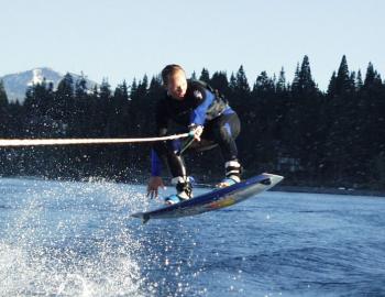 wakeboarder jumping a wake