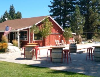 front view of winery with benches and tables outside