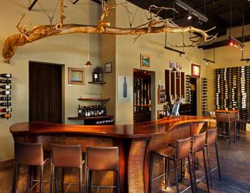 interior of wine bar with wine on walls