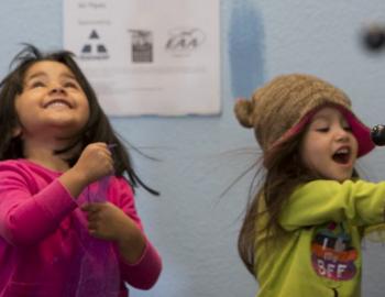 two young girls laughing