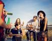 People sip beer while listening to live music 