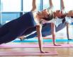 women holding a yoga pose