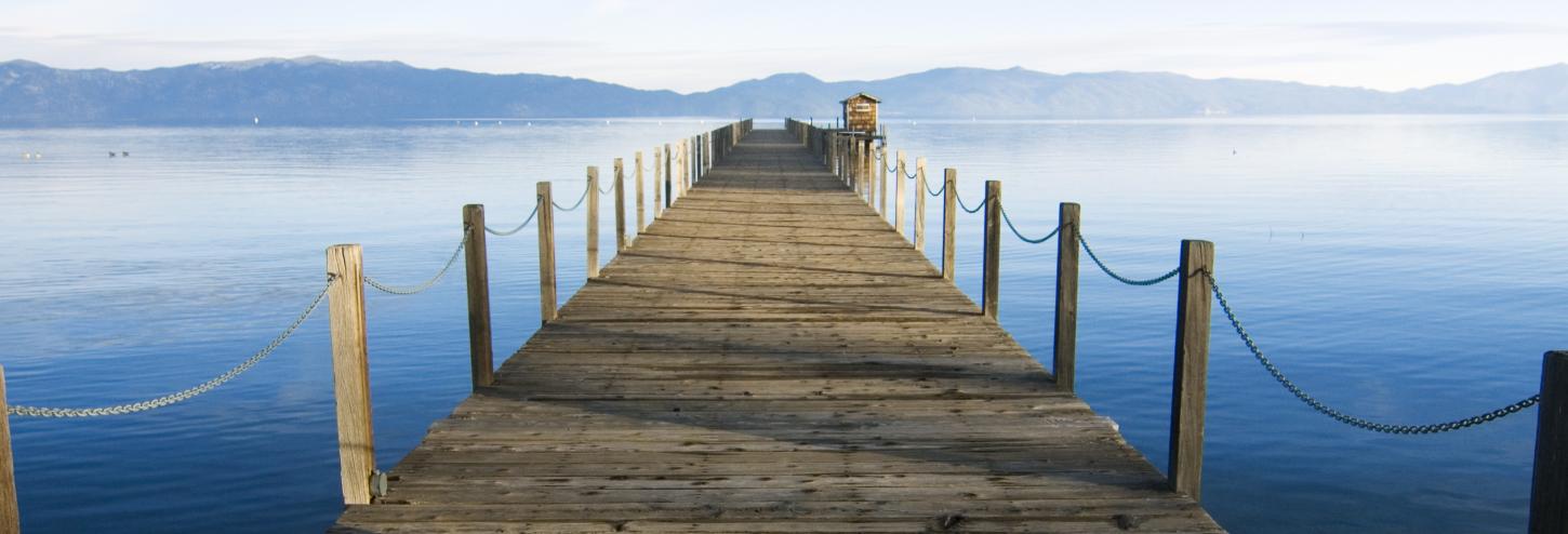 wooden dock with lake tahoe background