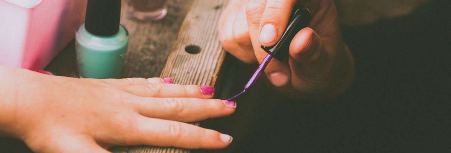 nail polish being applied to fingernails