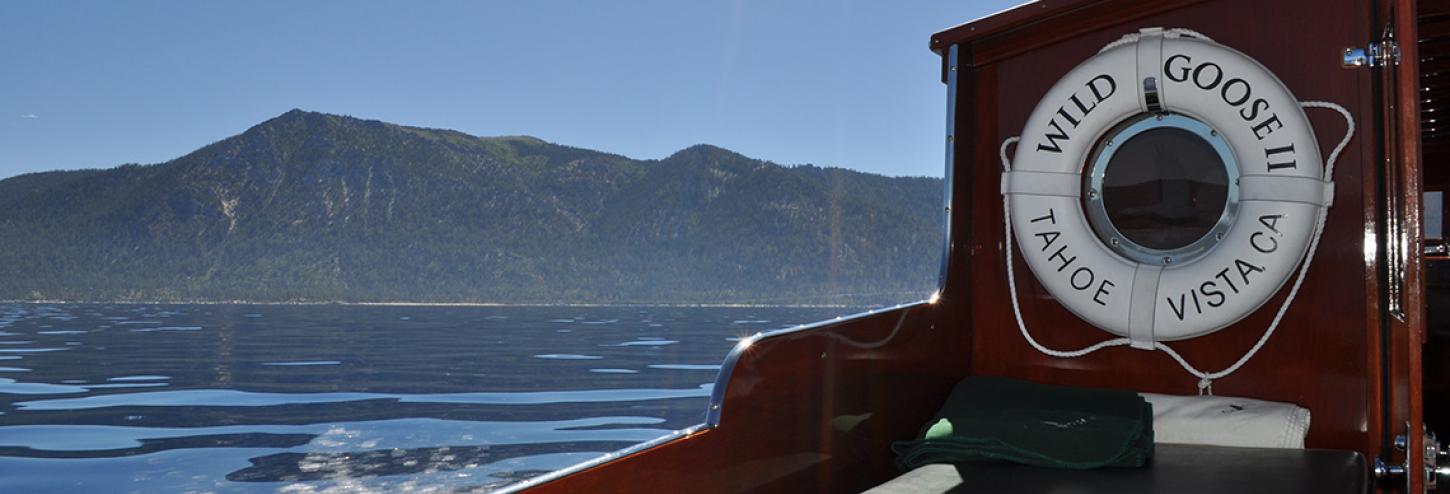 Wild Goose II life ring with calm water of tahoe in background