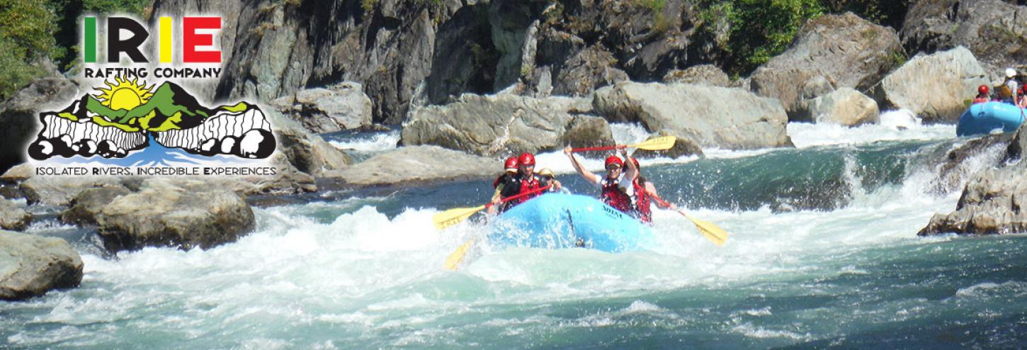 people in large white water raft in river