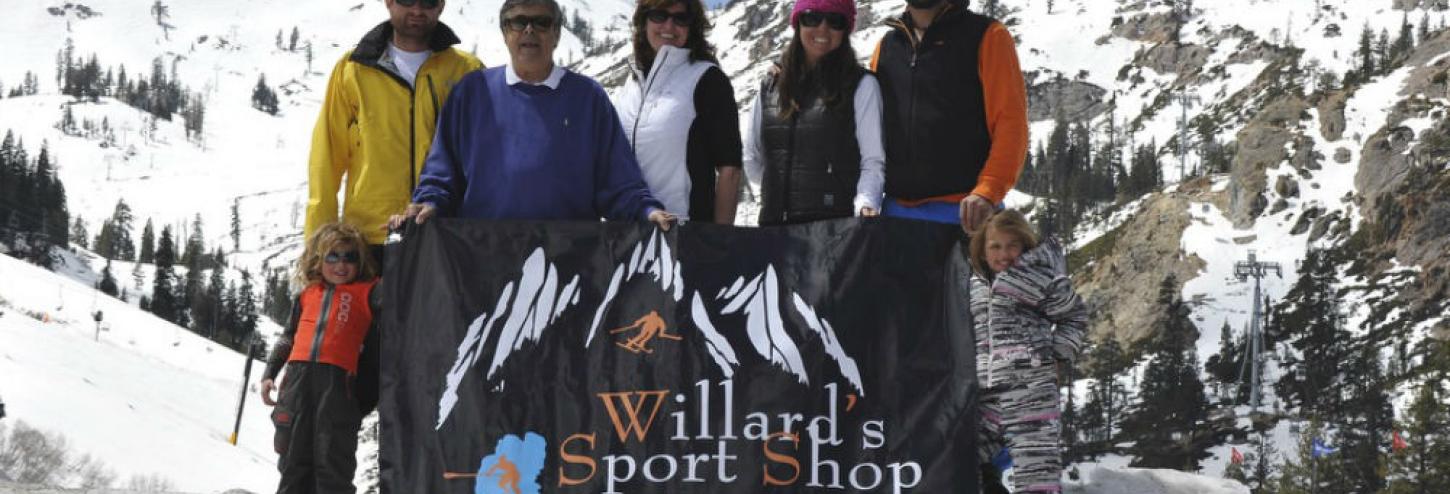people standing with willard sports logo
