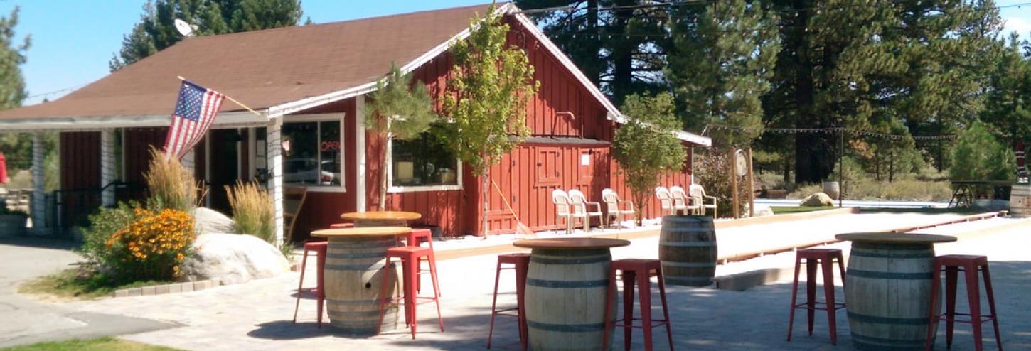 front view of winery with benches and tables outside