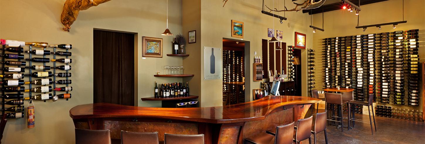 interior of wine bar with wine bottles on the wall