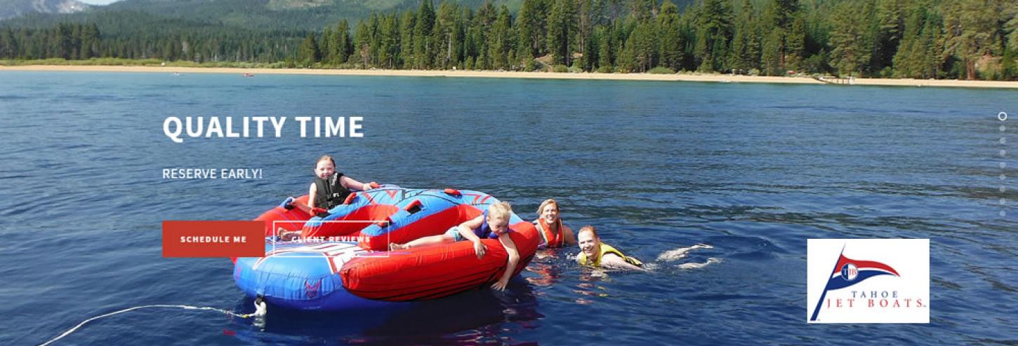 people playing in water with a large inner tube or boat toy