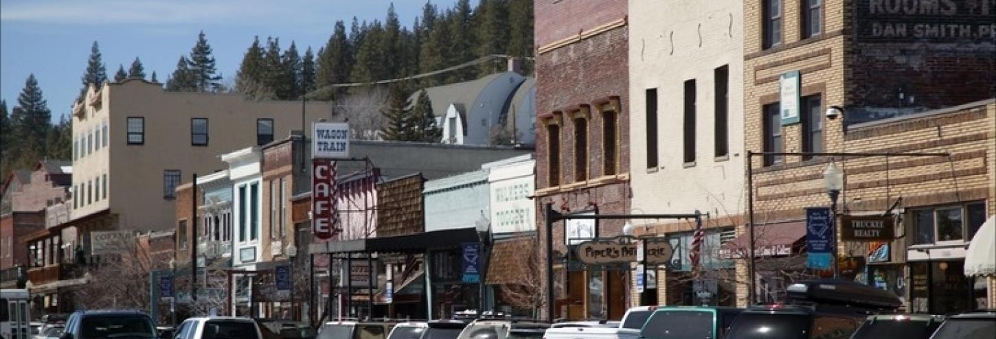 parked cars in old town truckee, old buildings in the background