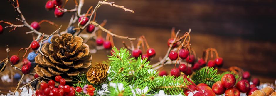 pinecones and red berries as a table centerpiece