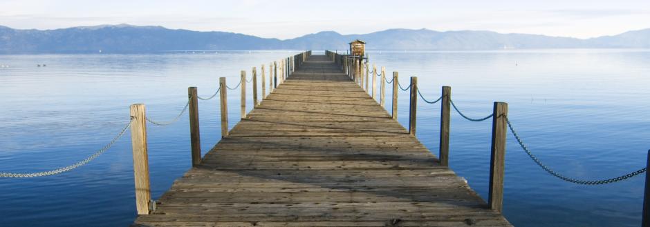 wooden dock with lake tahoe background