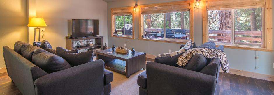 living room with tv and south facing windows