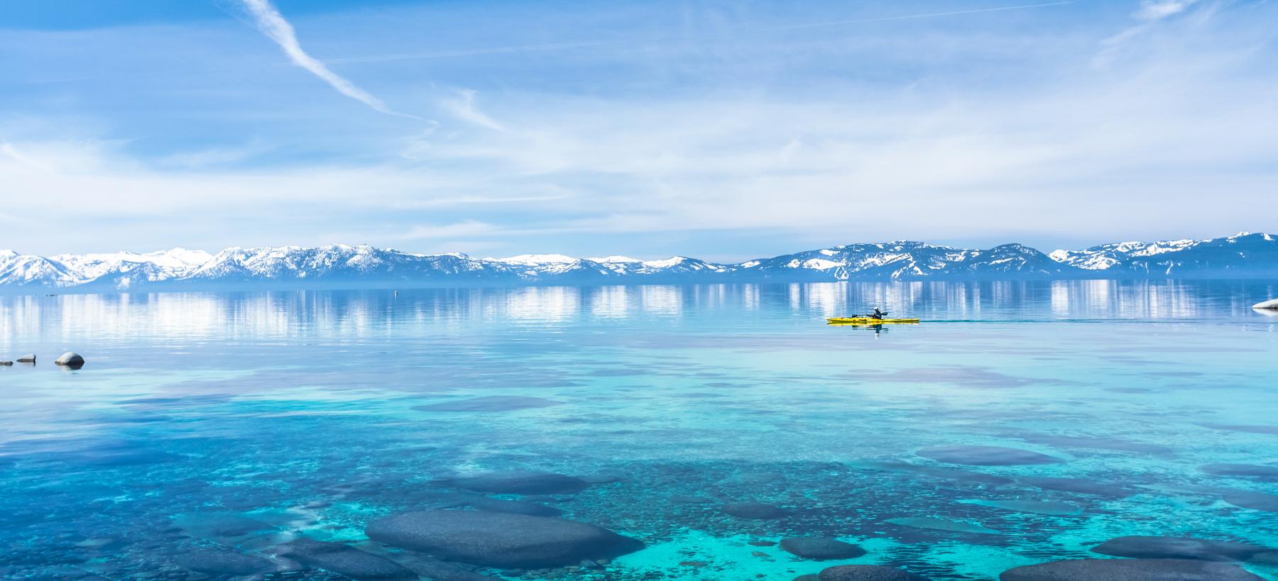 kayaker on crystal clear lake tahoe