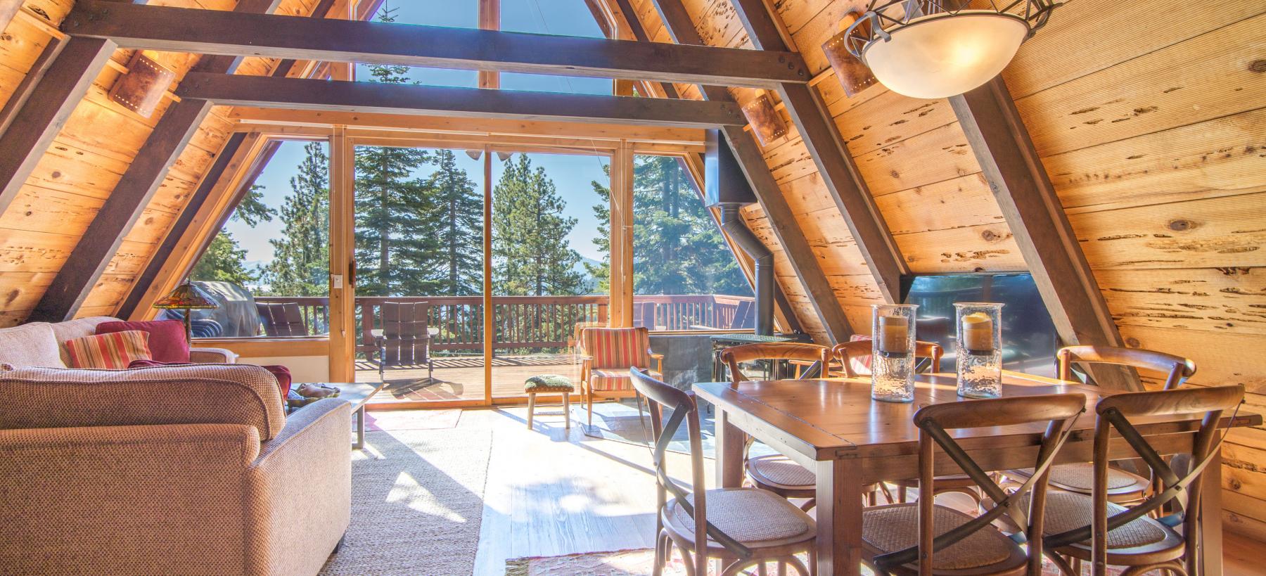 a frame wood cabin in lake tahoe with big windows