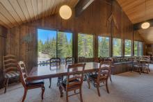 large dining table with a view out the adjacent window