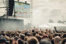 People enjoying a music festival outside