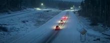 Cars driving on highway in the snow