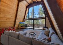 living room with tv and sunny windows 