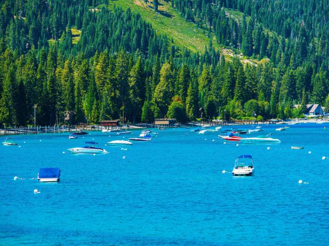 boats attached to buoys in lake tahoe waters