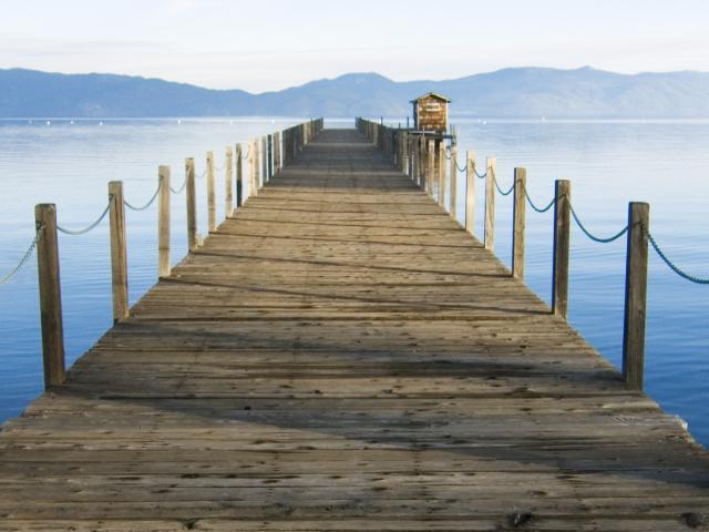 wooden dock with lake tahoe background