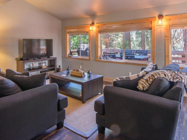 living room with tv and south facing windows