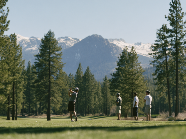 Golf group watching as a golfer drives on a Tahoe Area golf course